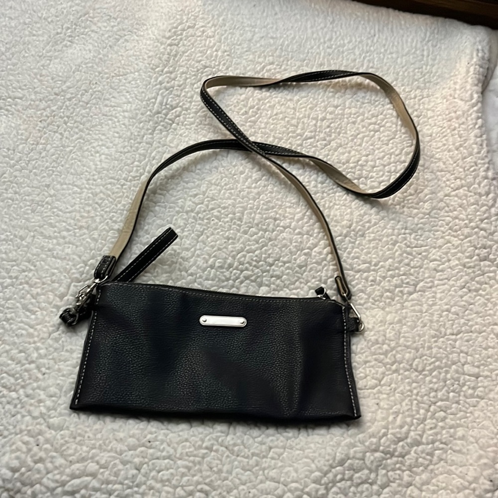 Black little handbag crossbody strap comes off to use as a clutch